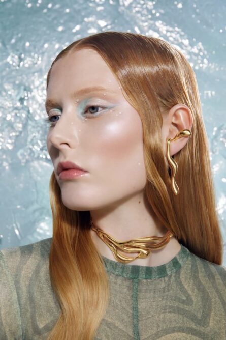 GOLD LIQUID EARRINGS THAT HOOK AROUND THE EARS - Image 1
